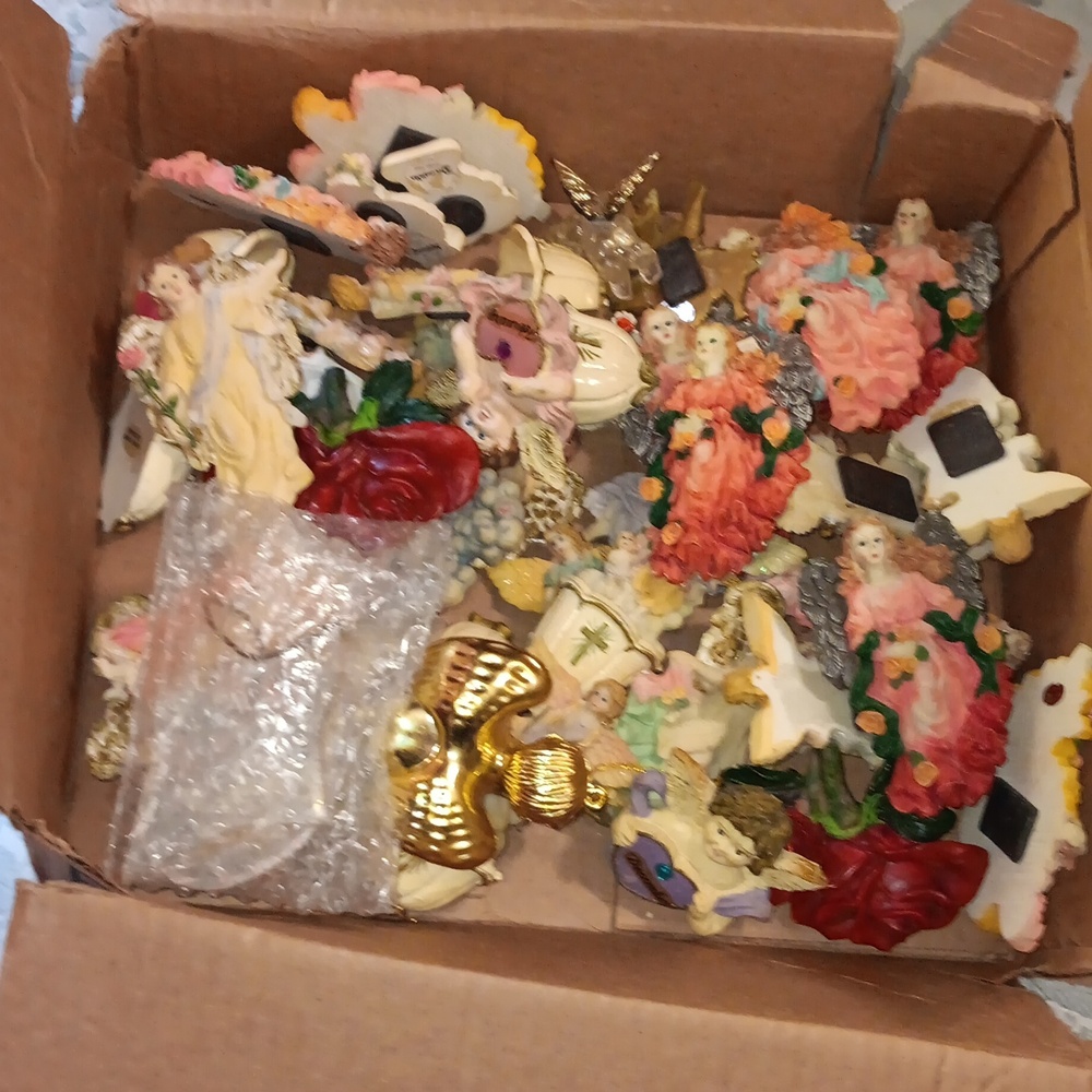 Box of angelic antique statues.